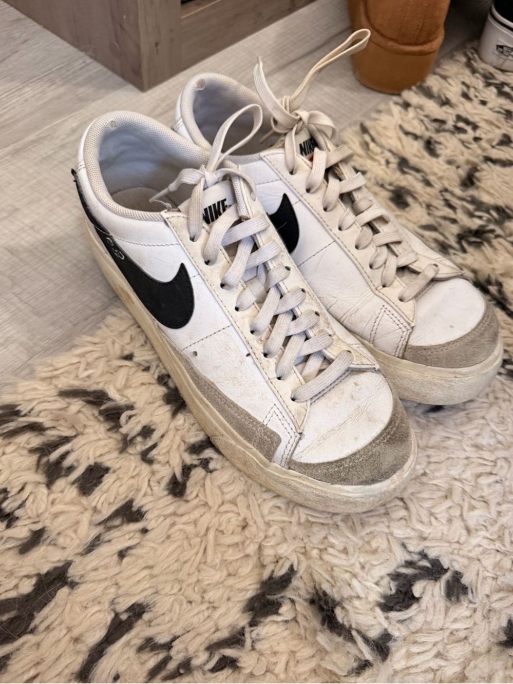 Nike White Sneakers with Black Swoosh and Gray Suede Accents
